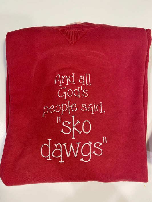 And all God’s people said “Sko dawgs” embroidered crewneck sweatshirt. Red